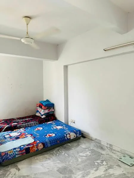 Bedroom features: white painted walls, marble flooring, ceiling fan, two single beds with colorful bedding, stack of blankets, window with natural light, light fixture on ceiling.