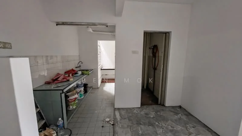 Kitchen features: white painted walls, grey tiled flooring, single-bowl stainless-steel sink, chrome pull-down faucet, kitchen cabinetry, countertop, open shelving, window with natural light. Room features: grey tiled flooring, white painted walls, doorway leading to another room.