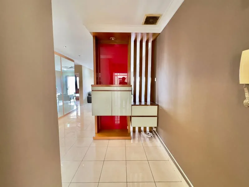 Room features: glossy white tile flooring, brown painted walls, wooden feature wall with red accent, built-in console with drawers, ceiling with recessed lighting, wall-mounted intercom, open layout, natural light from adjacent room; style: modern.