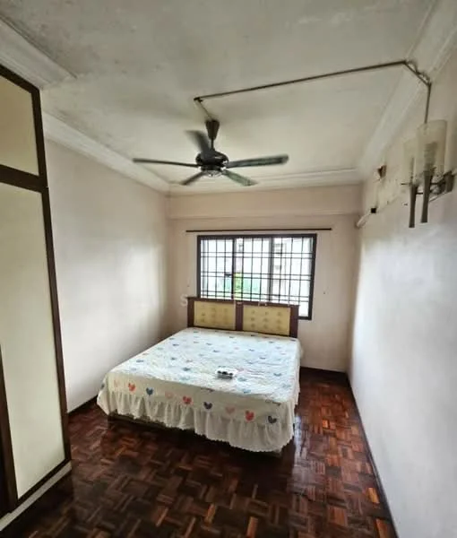 Bedroom features: queen-size bed with white bedspread, wooden parquet flooring, white painted walls, ceiling fan, window with grid pattern, built-in wardrobe with sliding doors, decorative wall sconces, crown moulding; style: traditional.