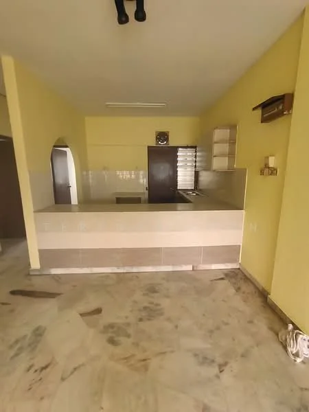 Kitchen features: yellow painted walls, marble flooring, kitchen counter with two-tone finish, wall-mounted cabinets, window with blinds, built-in sink, open layout, archway leading to another room.