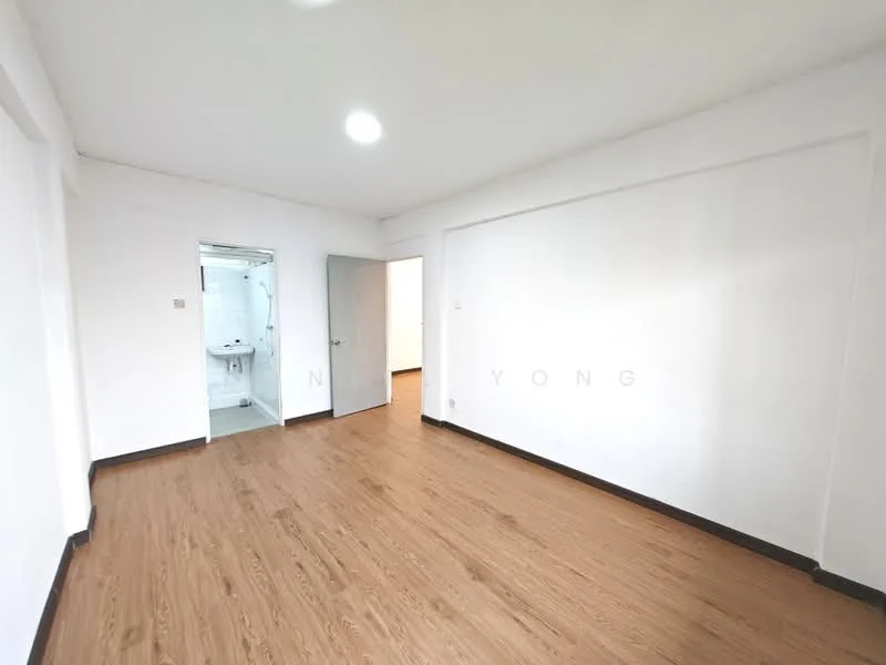 Room features: white painted walls, laminate flooring, recessed downlights, doorway leading to bathroom, doorway leading to another room, no visible furniture or decor; style: modern.