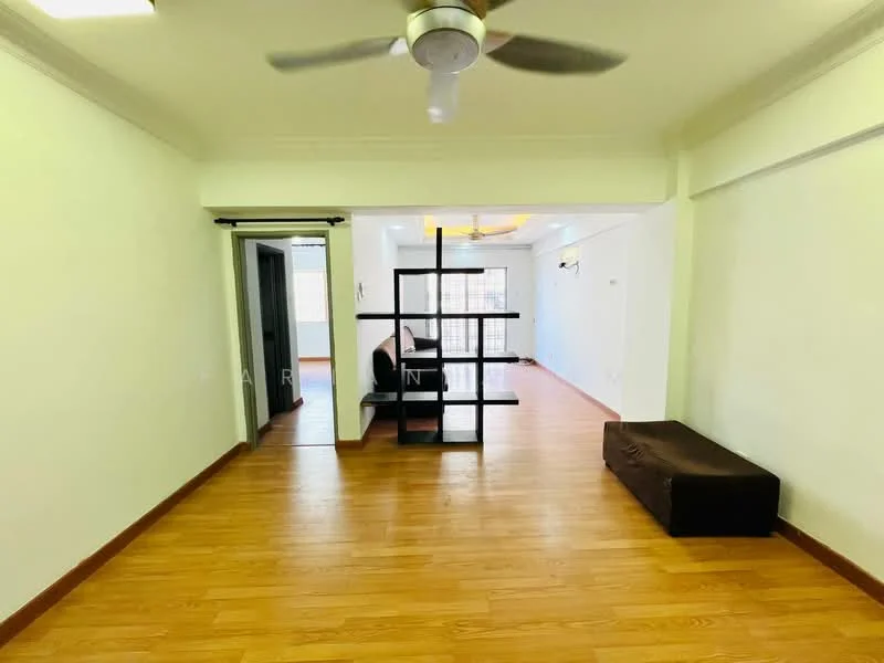 Living features: light wood laminate flooring, white painted walls, 5-blade ceiling fan with light, open layout, black bookshelf divider, sofa, brown ottoman, large window with natural light; style: modern.