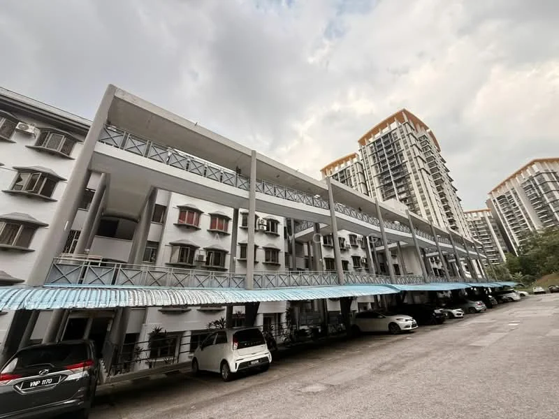 Exterior type: low-rise apartment block; features: concrete facade, grey painted facade, recessed balconies, flat roof, approximately 3-storey, covered parking area, manicured landscaping, surrounded by mature greenery; style: modern.