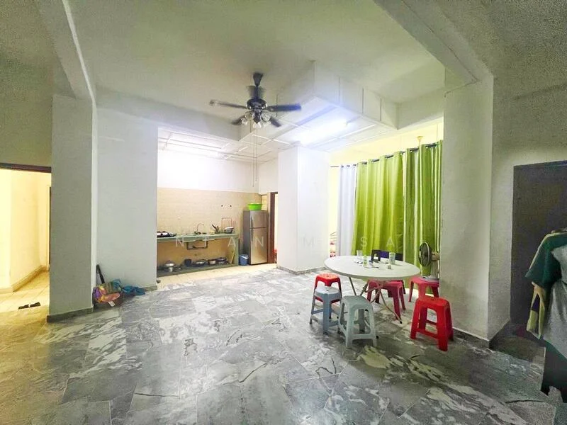 Room features: marble flooring, ceiling fan, white walls, green curtains, kitchen area with countertop, stainless-steel fridge, round dining table, plastic chairs in red and white, open layout, natural light from windows; style: modern.