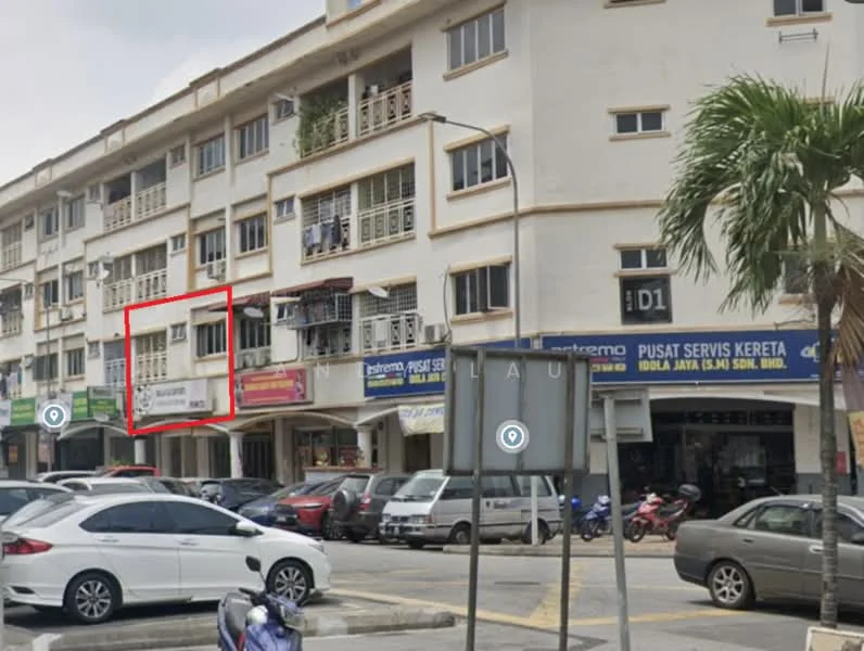 Exterior type: shophouse; features: 3-storey building, white painted facade, glass windows, signage on the building, balconies on upper floors, paved walkway, surrounded by vehicles, street view, palm tree in foreground; style: modern.