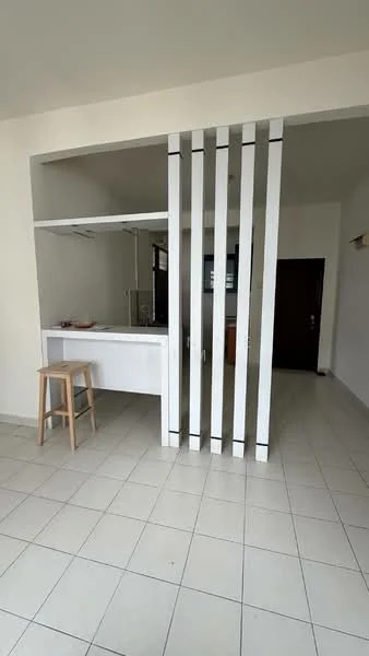 Room features: white walls, tile flooring, open layout, partition with vertical slats, kitchen counter, stool, natural light from windows, neutral color scheme; style: modern.