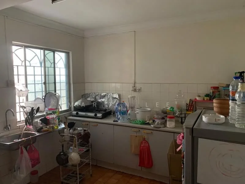 Kitchen features: single-bowl stainless-steel sink, chrome pull-down faucet, grey cabinetry, white tiled backsplash, countertop with clutter, window with decorative grille, ceramic tile flooring, kitchen appliances visible, multiple plastic containers, dish rack with dishes, water dispenser, various utensils and cookware.