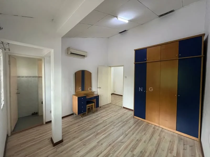 Bedroom features: wooden flooring, white painted walls, ceiling fan, built-in wardrobe with blue and wood finish, study desk with mirror, air conditioning unit, window with natural light, door leading to bathroom area.