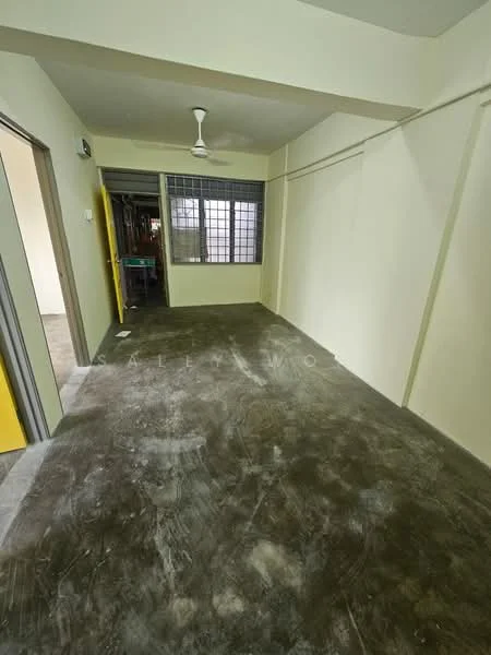 Room features: cream painted walls, concrete flooring, ceiling fan, large window with grid pattern, yellow door, open layout, no visible furniture, neutral color scheme; style: minimalist.