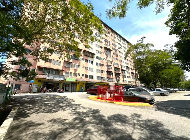Exterior type: low-rise apartment block; features: pink painted facade, multiple storeys, ground floor retail units, parking area, landscaped greenery, street lighting, curved driveway, surrounding trees; style: modern.