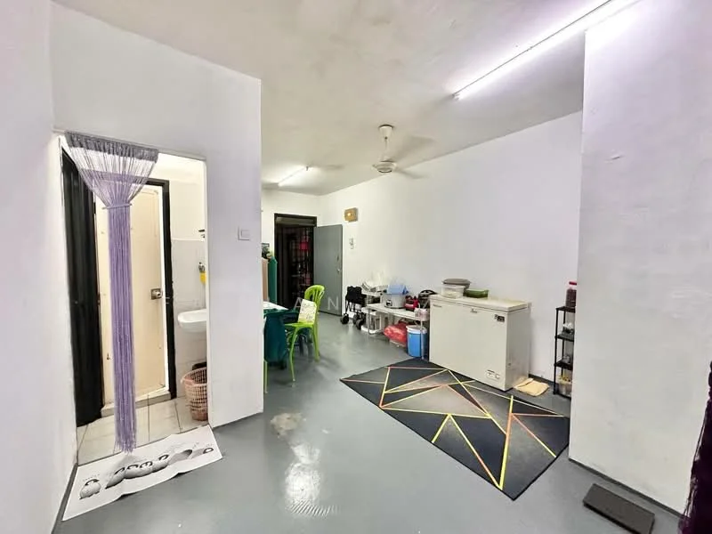 Room features: white painted walls, grey concrete flooring, ceiling fan, recessed lighting, open layout, area rug with geometric pattern, freezer, sink, toilet, shower area, storage shelves, laundry basket; style: minimalist.