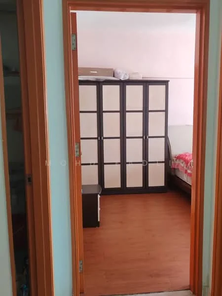 Room features: wood laminate flooring, built-in wardrobe with sliding doors, single bed with bedding, wall with light paint, orange door frame, window with natural light.