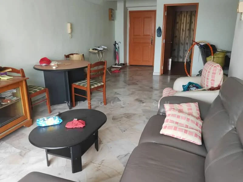 Living features: grey leather sofa, round black coffee table, 4-seater dining table, wooden dining chairs, marble flooring, wall-mounted TV, wooden cabinet, decorative cushions, light-colored walls, doorway leading to hallway. Room features: folding clothes rack, window with sheer curtains, door leading to other rooms.