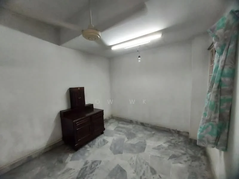Room features: white painted walls, marble flooring, ceiling fan, window with curtain, single wooden dresser.