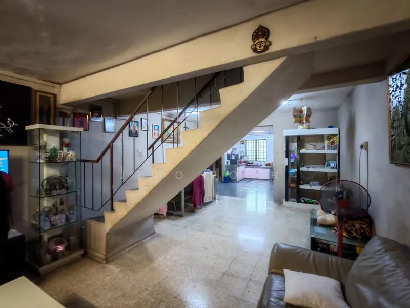 Living features: staircase with metal railing, cream painted walls, marble flooring, ceiling fan, decorative wall art, display cabinet, open layout, natural light from windows; style: traditional. Room features: furniture in various colors, shelves with decorative items, seating area with sofa.