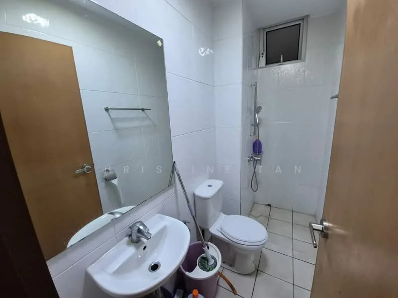 Bathroom features: white tiled walls, white ceramic floor tiles, single-sink vanity with chrome faucet, framed mirror above sink, one-piece toilet, handheld shower with wall-mounted holder, shower curtain rod, towel rack, toilet paper holder, purple storage container, cleaning supplies visible; style: modern.
