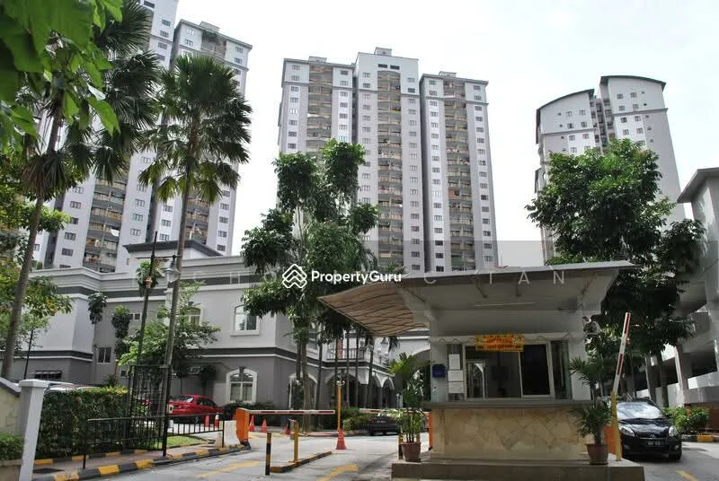 Exterior type: high-rise condominium; features: multiple-storey buildings, guard house at entrance, manicured landscaping, palm trees, driveway with interlocking pavers, surrounded by greenery; style: modern.