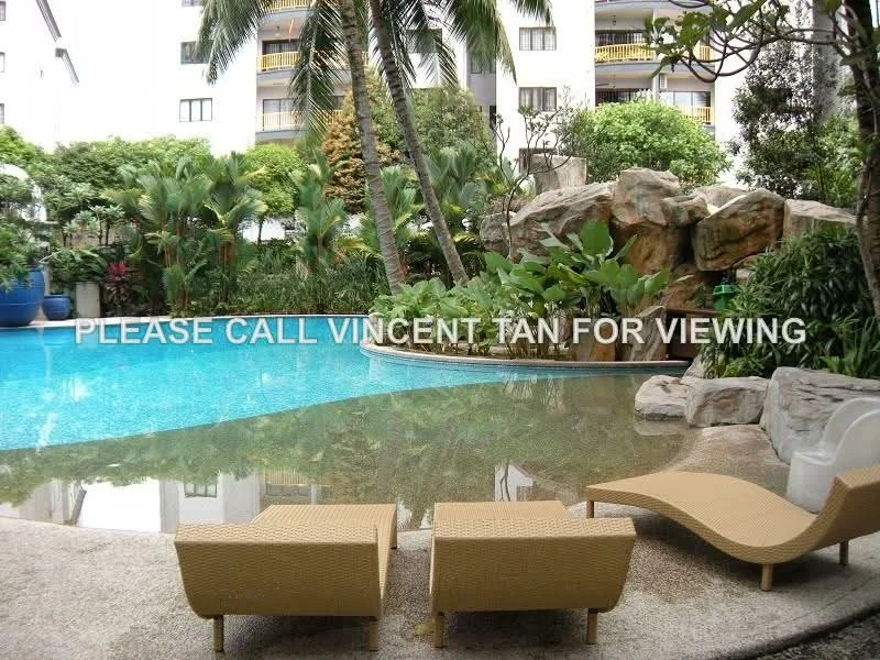 Exterior type: swimming pool deck; features: infinity pool, rock feature, tropical landscaping, palm trees, manicured garden, lounge chairs, poolside deck, water feature; style: tropical-modern.