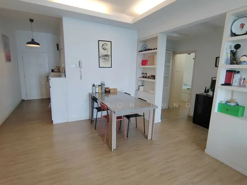 Dining features: light wood flooring, white painted walls, ceiling lights, dining table with 4 chairs, open shelving unit, decorative wall art, telephone on wall, doorway leading to hallway, built-in cabinets, kitchen area visible in background; style: modern. Room features: white painted walls, light wood flooring.