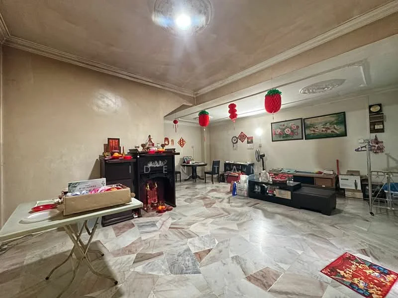 Room features: marble flooring, cream painted walls, tray ceiling, ceiling rose, decorative wall art, red decorative lanterns, wooden cabinet, coffee table, cardboard boxes, folding table, fan, wall-mounted clock; style: traditional.