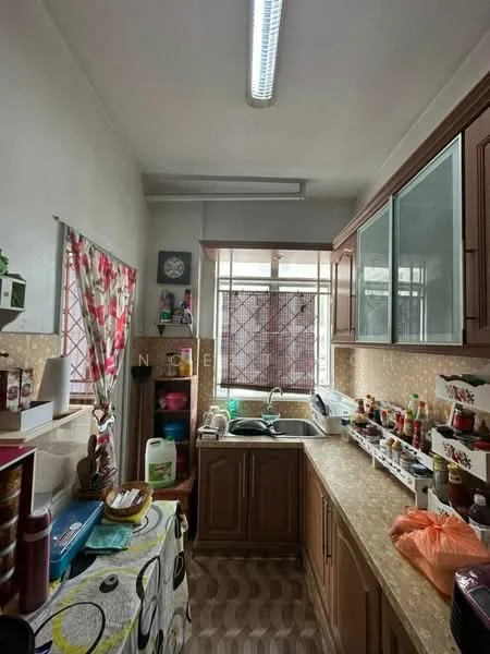 Kitchen features: brown wooden cabinetry, laminate countertop, single-bowl stainless-steel sink, chrome pull-down faucet, window with grid pattern, tile backsplash, kitchen appliances on countertop, decorative tablecloth, various storage containers, colorful curtains, wooden flooring with patterned design; style: modern.