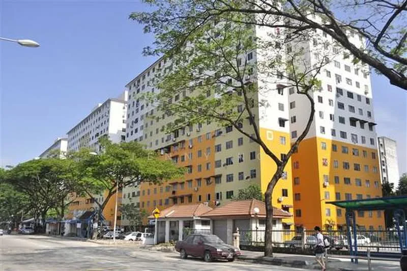 Exterior type: low-rise apartment block; features: yellow and white painted facade, multiple storeys, large windows, tree-lined street, manicured landscaping, entrance gate, covered walkway, parking area, street lighting, adjacent to road; style: modern.