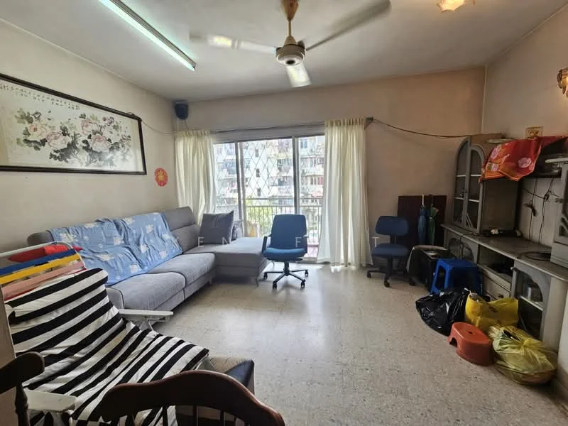 Living features: grey fabric sectional sofa, 2 blue office chairs, wooden dining chair, black and white striped armchair, large window with sheer curtains, ceiling fan, light fixture on ceiling, wall-mounted artwork with floral design, tile flooring, decorative items on shelves, plastic bags on floor.