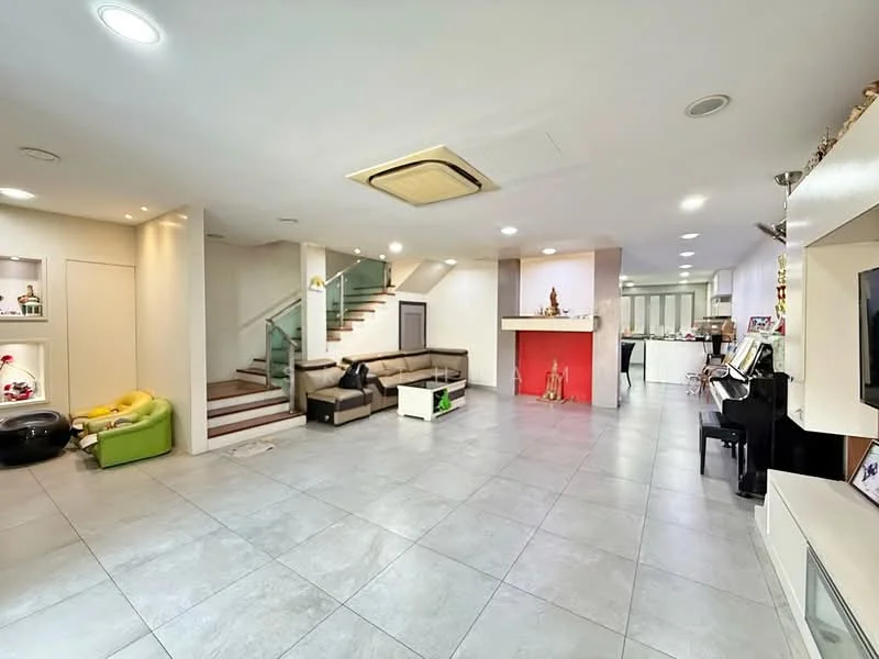 Living features: grey tile flooring, white painted walls, recessed downlights, ceiling-mounted air conditioning unit, L-shape sectional sofa in beige, black piano, fireplace with red accent wall, staircase with glass railing, built-in entertainment unit, decorative items on shelves, area rug, wall-mounted TV; style: modern.