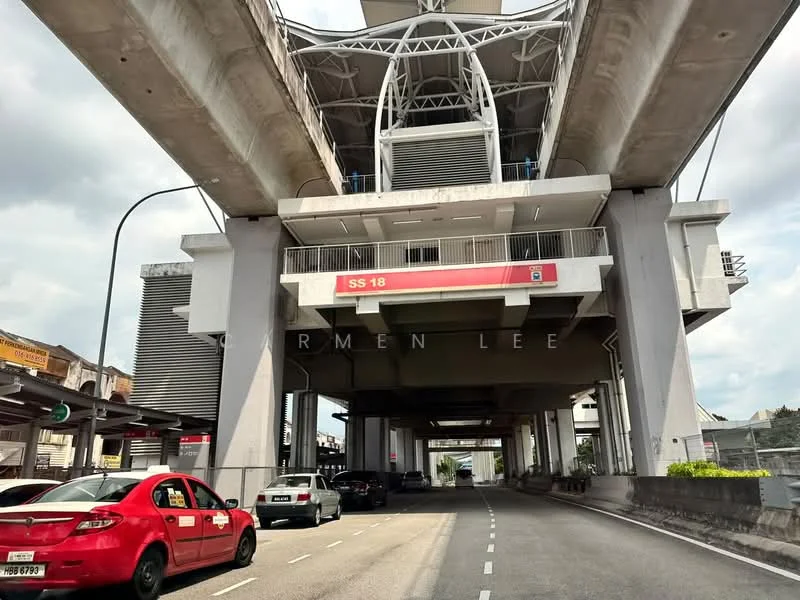 Exterior features: elevated structure, concrete columns, metal framework, roadway beneath, traffic lights, vehicles on road, signage visible, urban setting; style: modern.