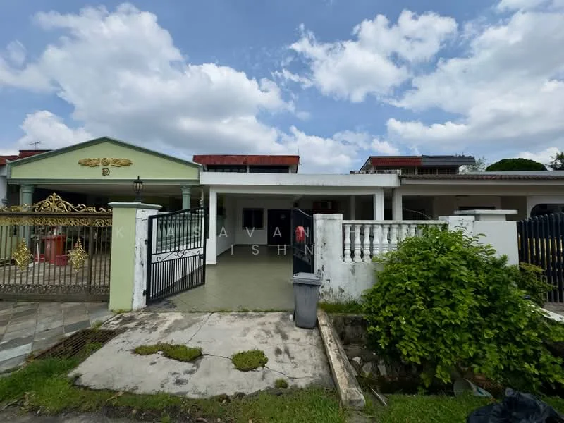 Exterior type: detached bungalow; features: white painted facade, green accent facade, gated entrance with decorative metalwork, paved driveway, manicured lawn, front porch, single-storey, surrounded by greenery; style: modern.