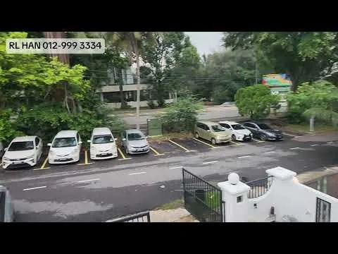 Exterior features: open-air parking lot, paved parking spaces, mature trees, landscaped greenery, street view, surrounded by residential buildings.