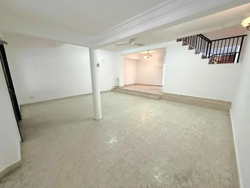 Room features: white painted walls, marble flooring, ceiling with crown moulding, column support, staircase visible in background, multiple light fixtures, open layout, natural light from windows; style: modern.