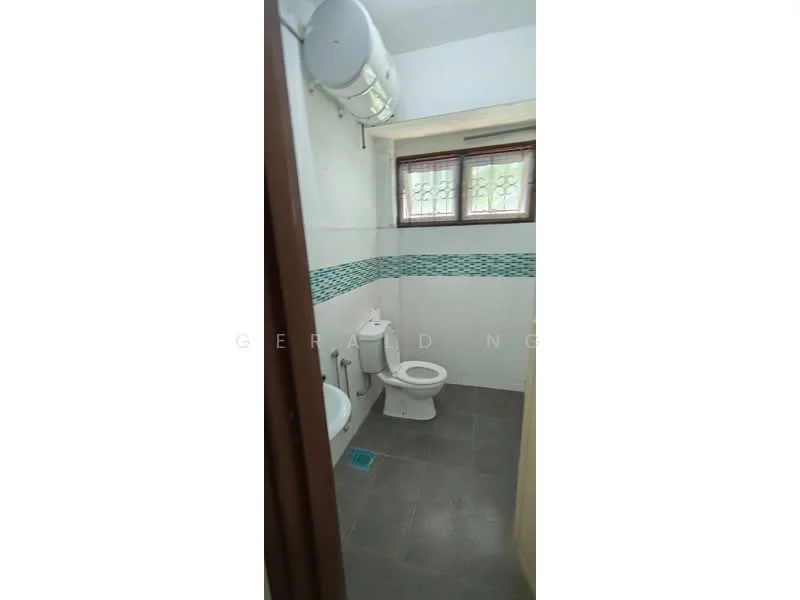 Bathroom features: white tiled walls, grey ceramic tile flooring, one-piece toilet, chrome basin mixer faucet, framed mirror, shower area with glass partition, exposed plumbing, window with security bars, blue mosaic tile accent strip, ceiling-mounted water heater; style: modern.