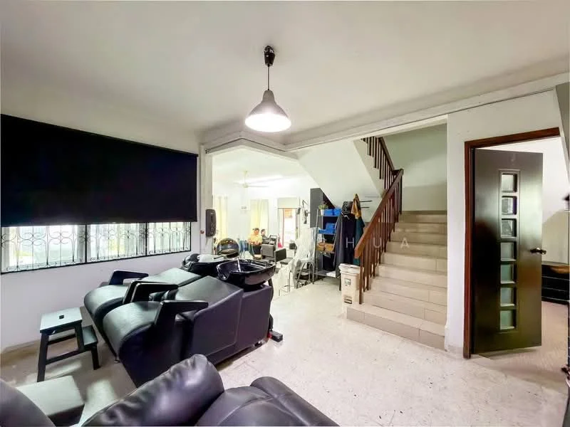 Living features: black leather recliner chairs, white walls, tile flooring, large window with black roller blinds, ceiling light fixture, open layout to dining area, staircase leading to upper floor, decorative wall panel, door leading to hallway; style: modern. Room features: staircase, open space leading to dining area.