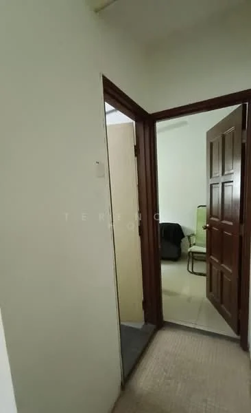 Room features: white painted walls, carpet flooring, wooden door, door frame, light switch, door handle, visible door opening, neutral color scheme.
