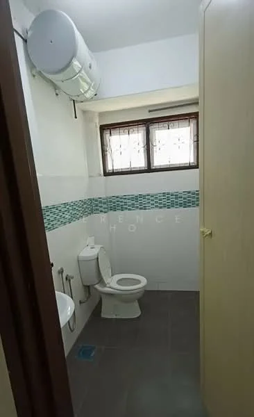 Bathroom features: white wall tiles, grey floor tiles, one-piece toilet, chrome basin mixer, framed mirror, shower area with glass partition, wall-mounted water heater, window with decorative grille, blue mosaic tile backsplash; style: modern.