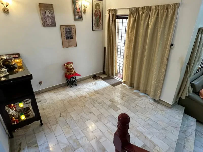 Room features: marble flooring, white walls, golden curtains, decorative wall art, wooden staircase, small decorative table, statues on display, window with security bars, sofa in background; style: traditional.