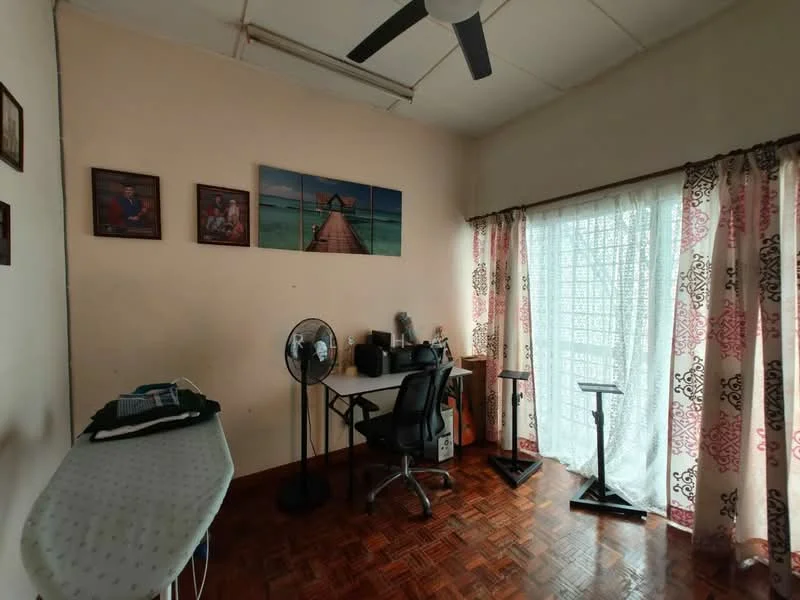 Room features: wooden flooring, cream painted walls, ceiling fan, large window with sheer curtains, desk with chair, photo frames on wall, standing fan, ironing board; style: minimalist.