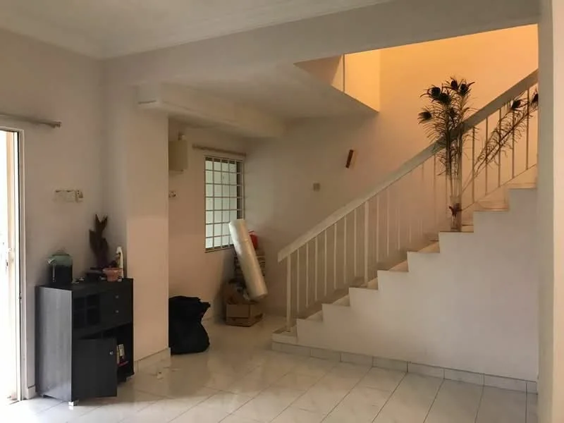 Room features: white painted walls, white ceiling, tile flooring, staircase with white railing, large window with grid pattern, door leading outside, small black cabinet, decorative plants, cardboard boxes, black trash bag; style: modern.