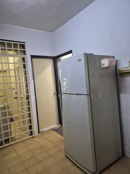 Room features: white fridge, tile flooring, white painted walls, door leading to another room, grid-patterned security door.
