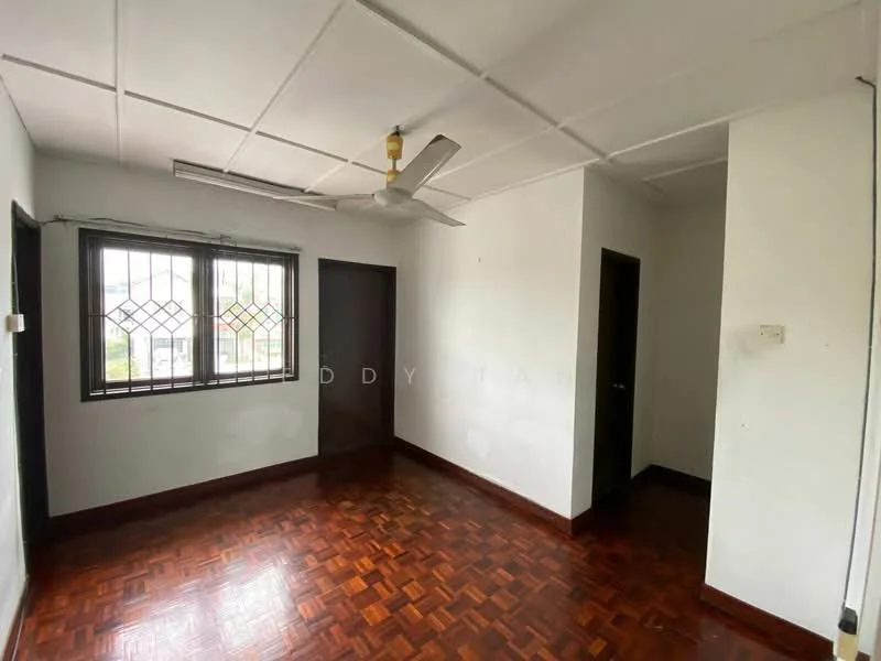 Room features: wooden flooring, white painted walls, ceiling fan, two windows with metal grilles, doorway leading to another room, doorway leading to hallway, flat ceiling, natural light from windows.