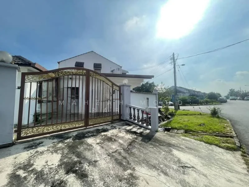 Exterior type: detached bungalow; features: gated entrance with decorative metal gate, concrete driveway, manicured lawn, paved walkway, single-storey building, surrounded by greenery, street view, front porch with railing, roof with tiles, outdoor lighting fixtures; style: modern.