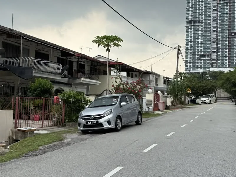 Exterior type: linked terrace house; features: two-storey linked terrace houses, white painted facade, red brick accents, manicured lawn, paved walkway, surrounded by greenery, street view, parked car on street, overcast sky; style: modern.