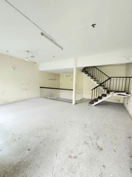 Room features: concrete flooring, white painted walls, exposed ceiling, 2 ceiling fans, spiral staircase, railings, large open space, no visible windows.