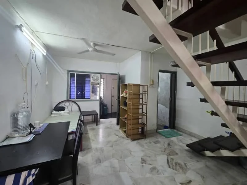 Living features: marble flooring, white painted walls, ceiling fan, wooden staircase, window with sheer curtains, black dining table, wooden shelving unit, green mat, sofa, door leading to another room.