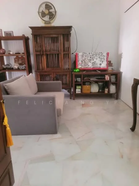 Living features: grey fabric sofa, wooden side table, wooden cabinet with glass doors, decorative items on shelves, marble flooring, ceiling fan, wall clock, television on stand; style: traditional.