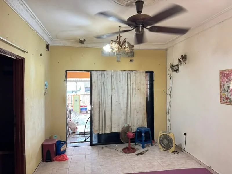 Living features: yellow painted walls, white ceiling with crown moulding, 5-blade ceiling fan with light, chandelier, sliding glass door, curtains, tile flooring, wall-mounted air conditioning unit, wall-mounted electrical outlet, decorative wall fixtures, small fan, blue plastic chair, plastic storage box.