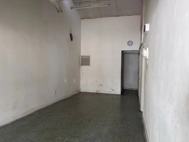 Room features: white painted walls, grey tiled flooring, ceiling lights, window unit air conditioner, doorway leading to another room, wall-mounted clock, no visible furniture or decor.