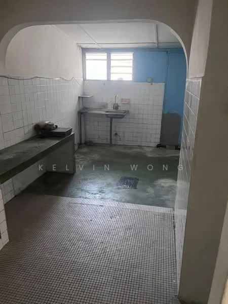 Laundry features: white tiled walls, green concrete countertop, single-bowl stainless-steel sink, window with horizontal slats, grey washing machine, mosaic tile flooring, drainage outlet on floor, light fixture on ceiling.